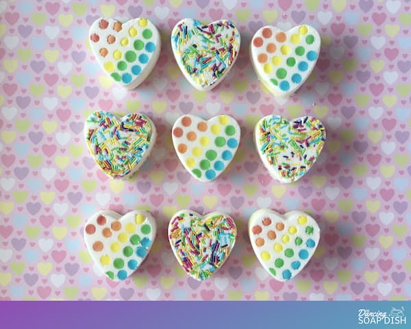 heart-shaped white bath bombs covered with rainbow sprinkles