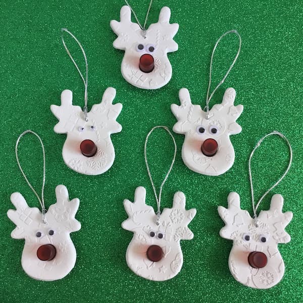 white reindeer clay ornaments with red noses