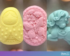 three bars of soap pink butterfly yellow baby doll blue pony