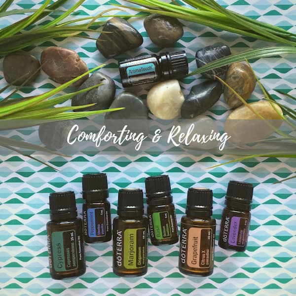 the title 'comforting and relaxing' surrounded by bottles of doterra aromatouch, peppermint, cypress, marjoram, grapefruit and lavender essential oils