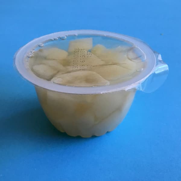 plastic fruit cup filled with diced pear