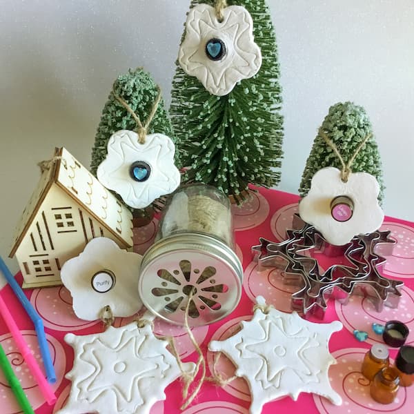 essential oil diffuser ornaments made from clay with 1ml glass vials punched through the middle hanging from mini pine trees