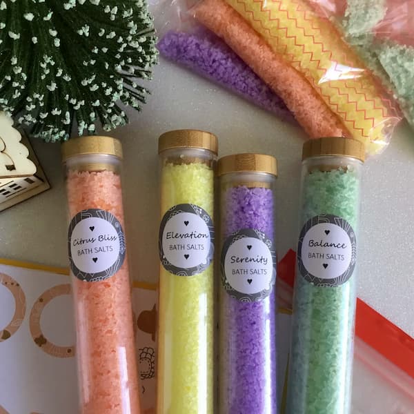 labelled bath salts tubes in four scents