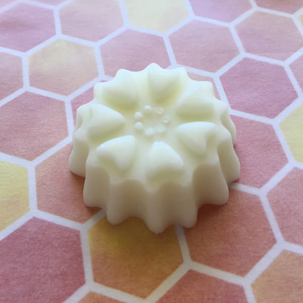 essential oil lotion bar in the shape of a heart blossom