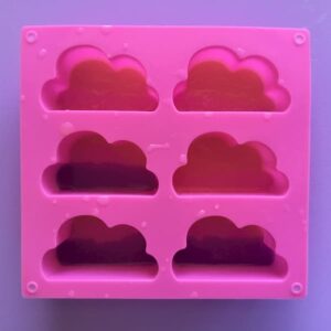 cloud silicone mould filled with thin layer of clear, coloured soap