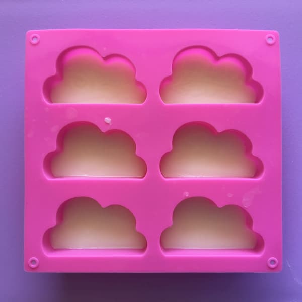 six cavity cloud shaped mould filled with melt and pour soap