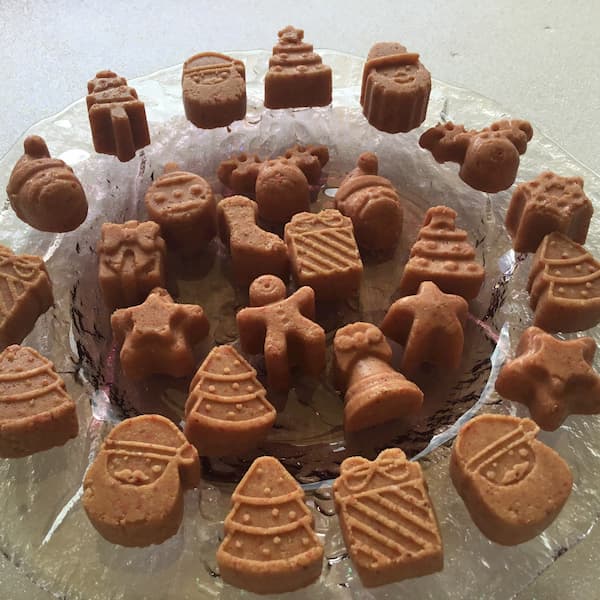 a plate with christmas-themed essential oil bliss balls