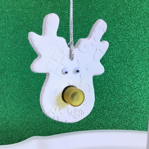 reindeer essential oil diffuser ornament with yellow sample vial nose