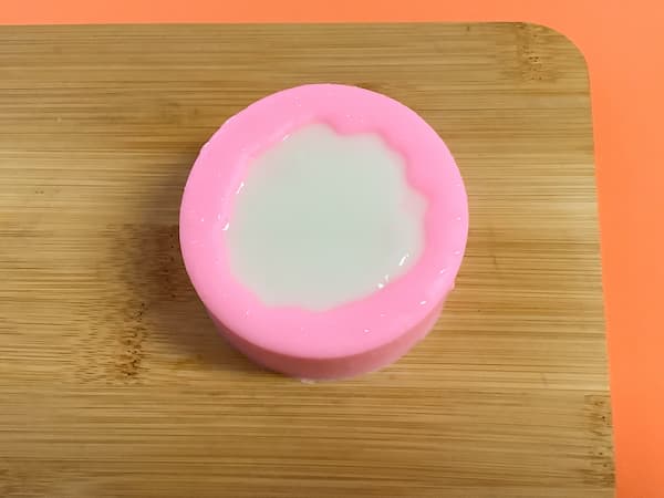 a silicone mould filled to the brim with white melt and pour soap base