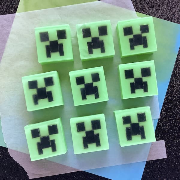 nine minecraft creeper melt and pour soap bars laid out in a grid fashion