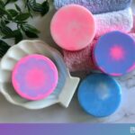 four round tie dye soap bars coloured pink, white and blue