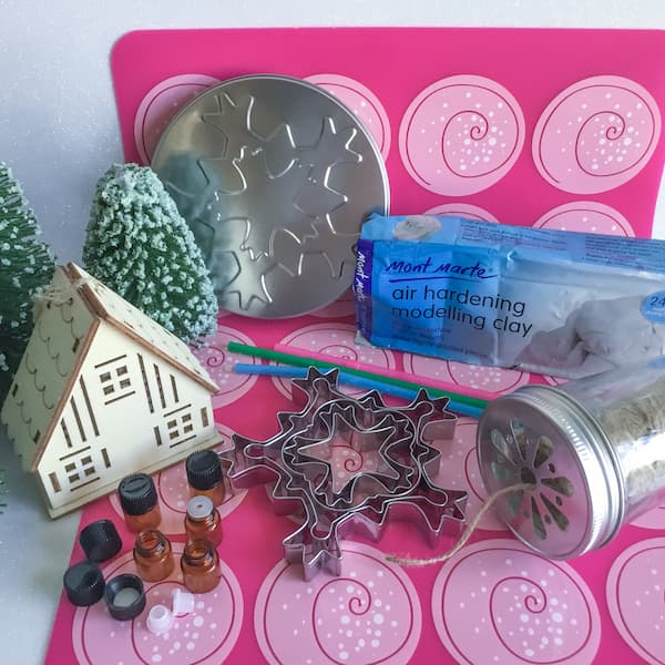 a collection of materials required to make white clay essential oil diffuser ornaments