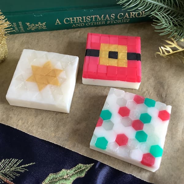 three Christmas themed mosaic soap bars