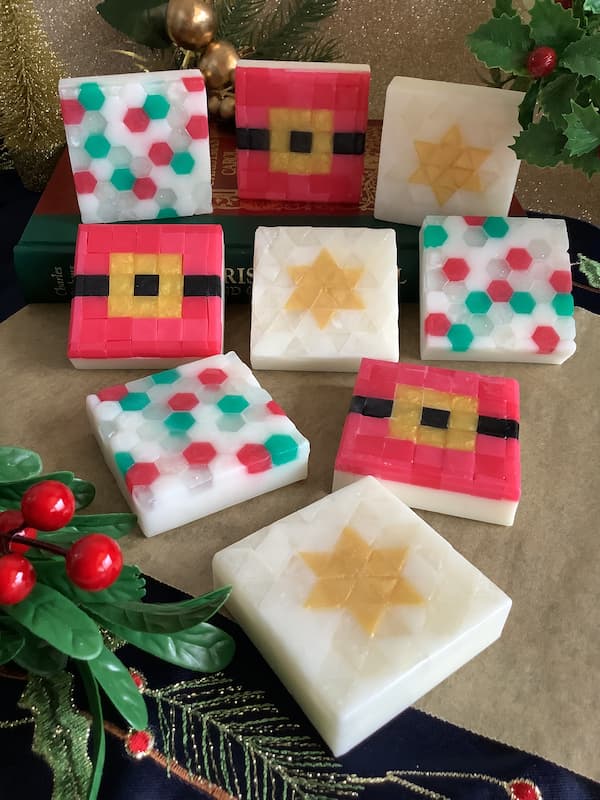 a collection of nine square mosaic soap bars with three different Christmas designs