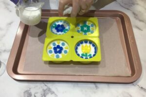 pouring white soap base to 'grout' mosaic soap tiles