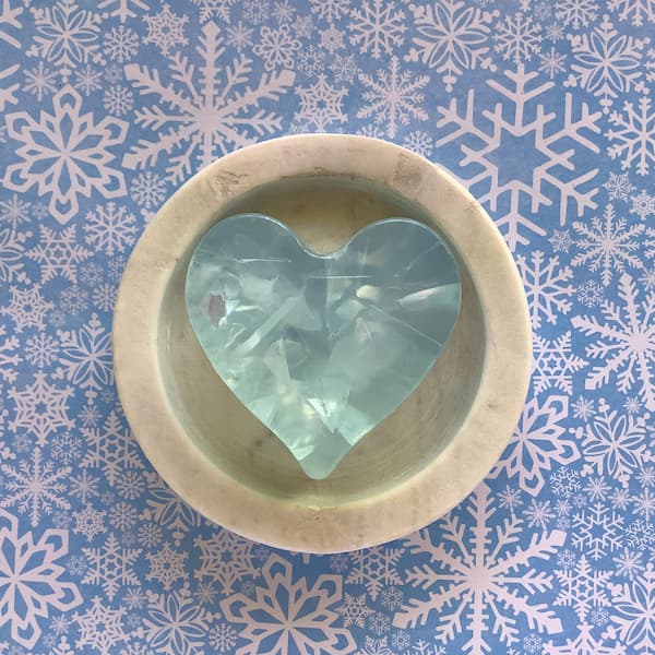 a heart-shaped soap bar that looks like it is frozen