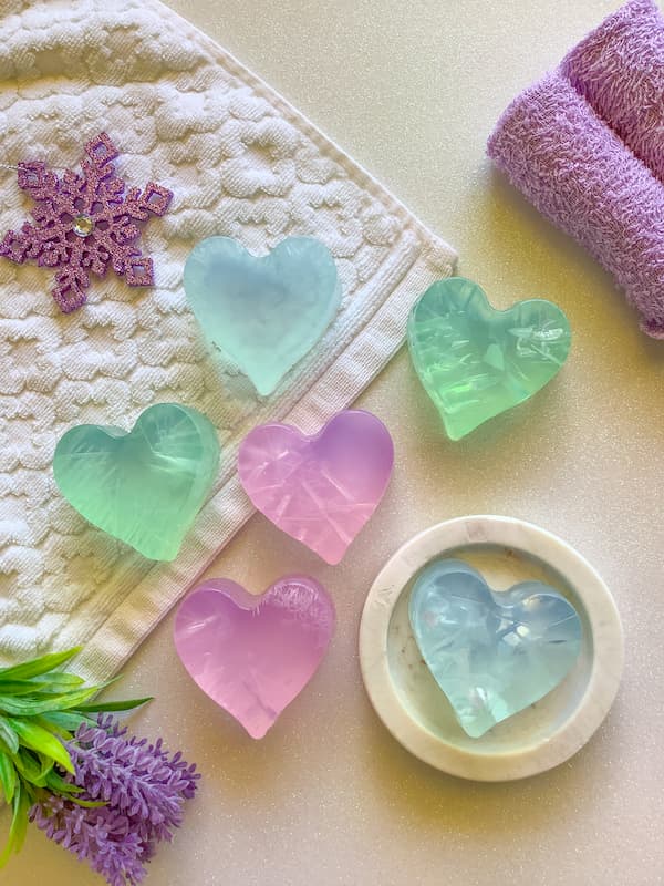 crystallised blue, purple and green clear soap bars in the shape of a heart