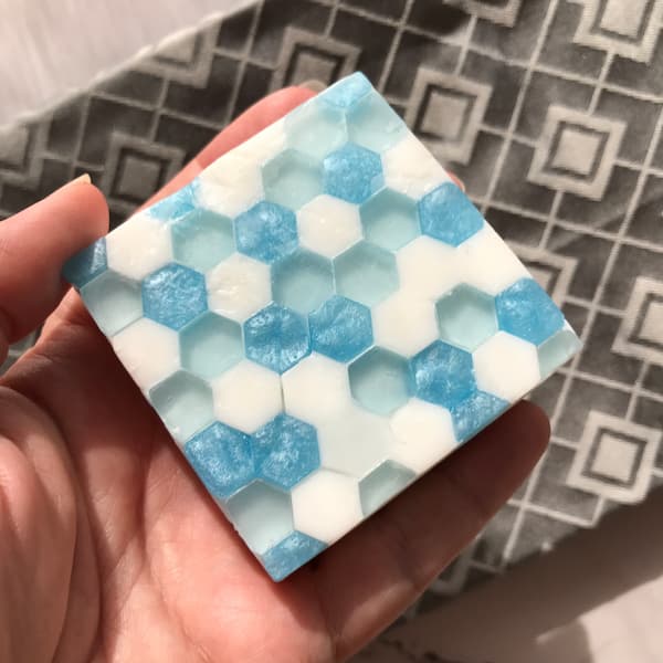 a square bar of glass tile effect soap with blue highlights