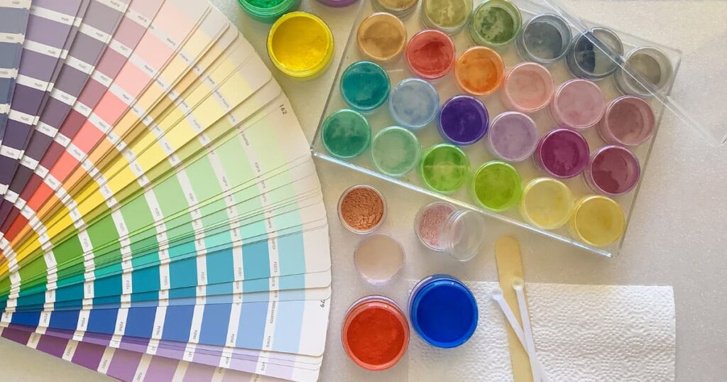 a set of 24 mica colours sitting next to some paint colour swatches