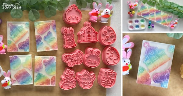 A colourful Easter themed soap making setup featuring pastel rainbow soap bars and pink cookie moulds shaped like bunnies, eggs, butterflies, chicks, and a church. Small bunny figurines are placed around the display. On the right, a close up shows a plastic paint palette filled with rainbow colored mica paint and small finger sponges, highlighting the creative process.