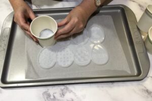 fitting a paper cup template to an egg shaped resin mould