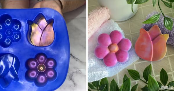 A side‑by‑side collage demonstrating a painted‑mica soap technique. On the left, a blue silicone mould contains flower and tulip shaped cavities that have been dry brushed with pink and yellow mica to create detailed accents before pouring. On the right, the finished purple soap bars are displayed on a textured surface. One is a flower with pink mica-painted over the purple petals and a yellow mica-painted centre. The other is a tulip soap bar with soft shades of pink, peach, and yellow mica covering the purple surface. The mica on both soap bars has been smudged in areas to reveal more of the background purple colour of the soap. White and lavender towels and green leafy stems surround the soaps, creating a fresh, spa‑style presentation.